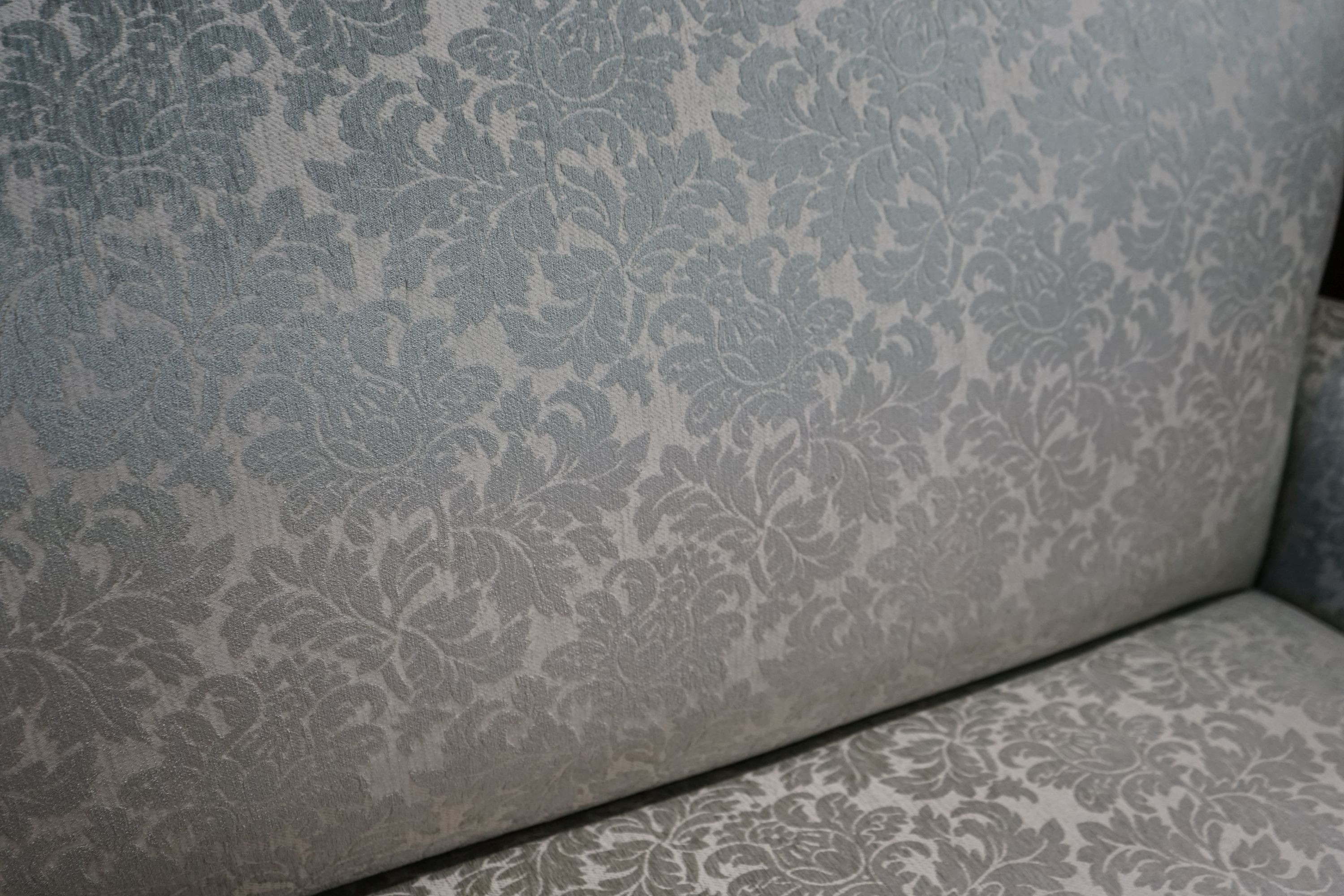 A George III style upholstered two seater settee, length 166cm, depth 72cm, height 99cm